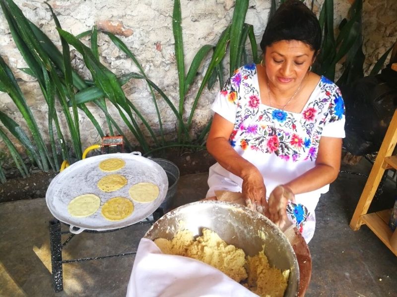 Mexican woman making tortillas a mano