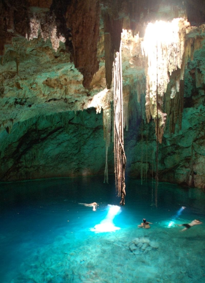 guests swimmng in Chacsinicche Cenote