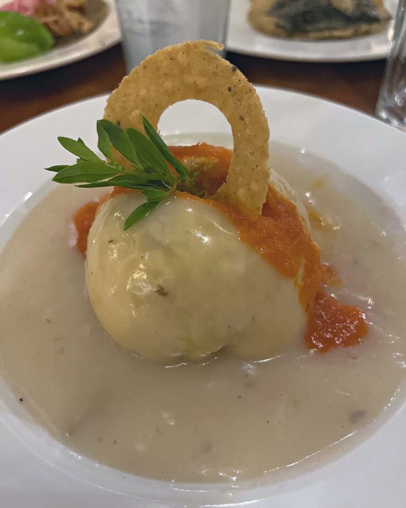 plate of queso relleno, a stuffed ball of cheese and one of the best yucatan foods