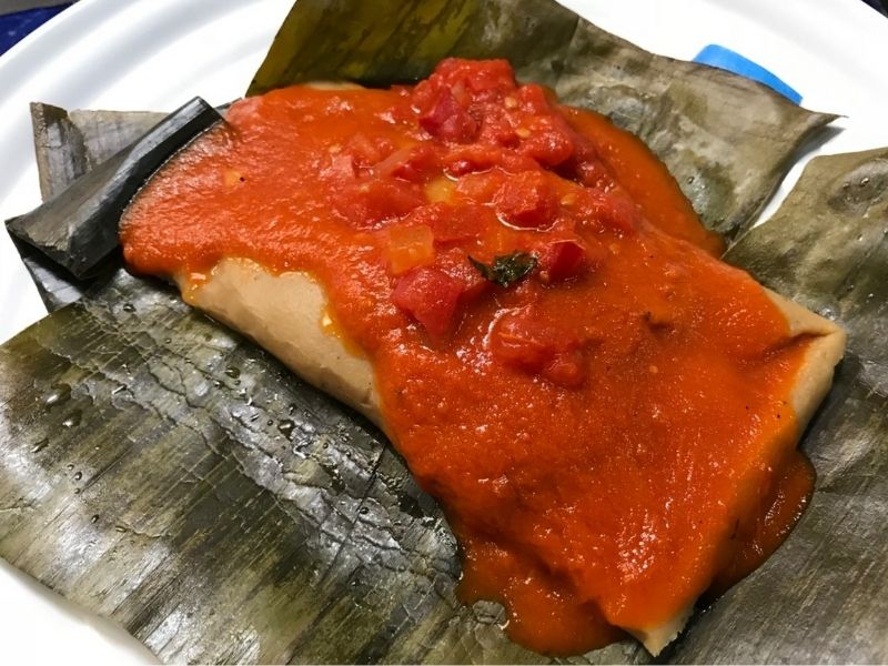 vaporcito tamale covered in red salsa | best yucatan foods
