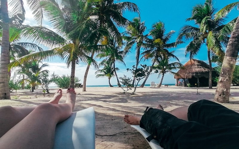 couple lounging in chicxulub beach | beach near merida